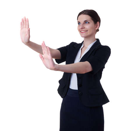 Smiling businesswoman standing over white isolated background working with virtual screen, business, education, office, future technology conceptの写真素材