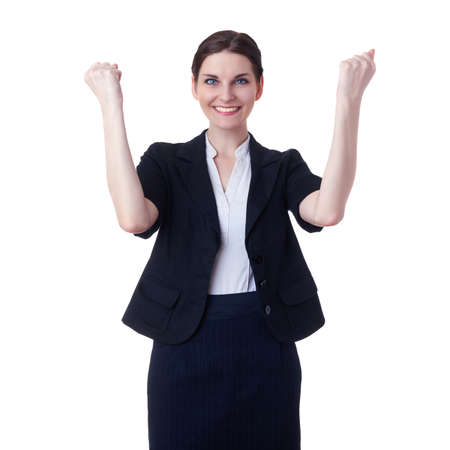 Smiling businesswoman standing over white isolated background celebrating, business, education, office, luck, victory conceptの写真素材