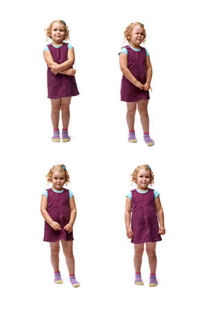 Young little girl with curly hair in purple dress standing over isolated white backgroundの写真素材