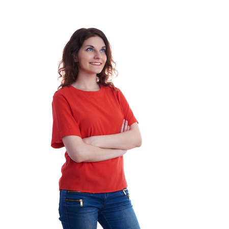 Smiling young woman in casual clothes over white isolated background with crossed hands, happy people conceptの写真素材