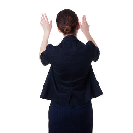 Businesswoman standing over white isolated background working with virtual screen, business, education, office, future technology conceptの写真素材