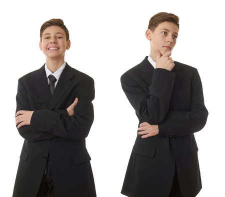 Cute teenager boy in back business suit with crossed arms over white isolated background, half body, future career conceptの写真素材