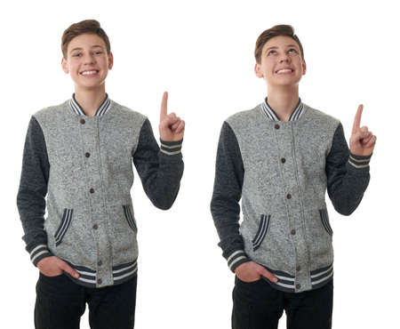 Set of cute teenager boy in gray sweater pointing up over white isolated background, half bodyの写真素材
