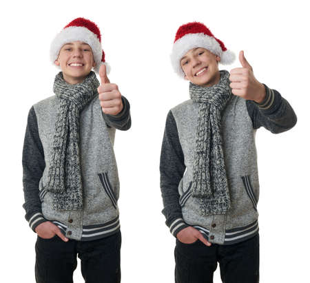 Set of cute teenager boy in gray sweater and christmas hat showing thumb up sign over white isolated background, half bodyの写真素材