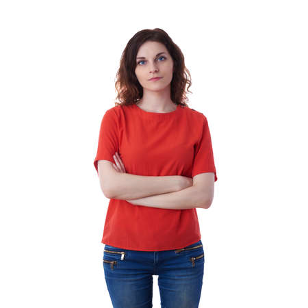 Smiling young woman in casual clothes over white isolated background with crossed hands, happy people conceptの写真素材