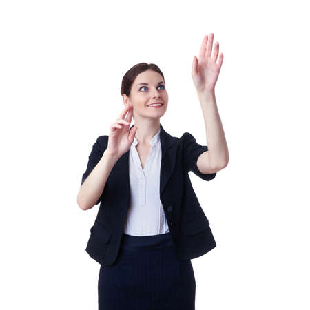 Smiling businesswoman standing over white isolated background working with virtual screen, business, education, office, future technology conceptの写真素材