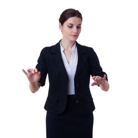 Smiling businesswoman standing over white isolated background working with virtual screen, business, education, office, future technology conceptの写真素材