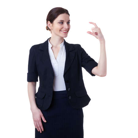 Smiling businesswoman standing over white isolated background showing this size, business, education, office conceptの写真素材