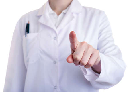 Female doctor assistant scientist in white coat over white isolated background pointing, showing direction or pushing button, healthcare, profession, science and medicine conceptの写真素材