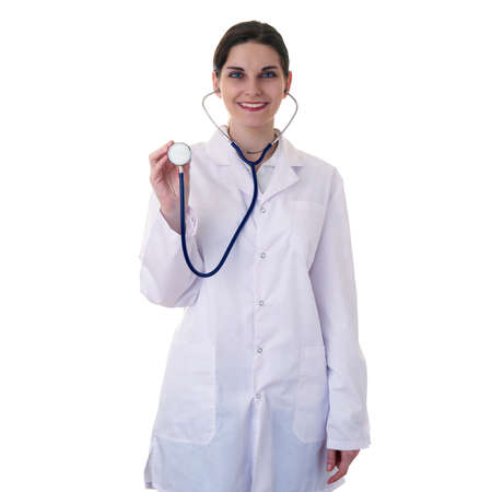 Smiling female doctor in white coat over white isolated background using stethoscope, healthcare, profession and medicine conceptの写真素材