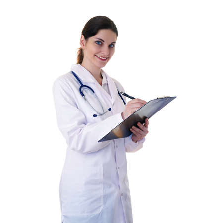 Smiling female doctor in white coat over white isolated background with stethoscope and clipboard, healthcare, profession and medicine conceptの写真素材