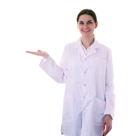 Smiling female doctor assistant scientist in white coat over white isolated background holding something on palm, healthcare, profession, science and medicine conceptの写真素材