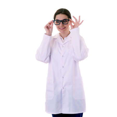 Smiling female doctor assistant scientist in white coat with glasses over white isolated background, healthcare, profession, science and medicine conceptの写真素材