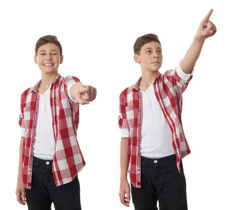 Set of cute teenager boy in red checkered shirt pointing forward over white isolated background, half bodyの写真素材
