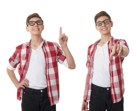 Set of cute teenager boy in red checkered shirt and glasses pointing up over white isolated background, half bodyの写真素材