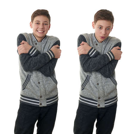 Set of cute teenager boy in gray sweater trying get warmer over white isolated background, half bodyの写真素材