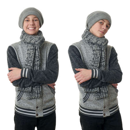 Set of cute teenager boy in gray sweater, hat and scarf with crossed arms over white isolated background, half bodyの写真素材