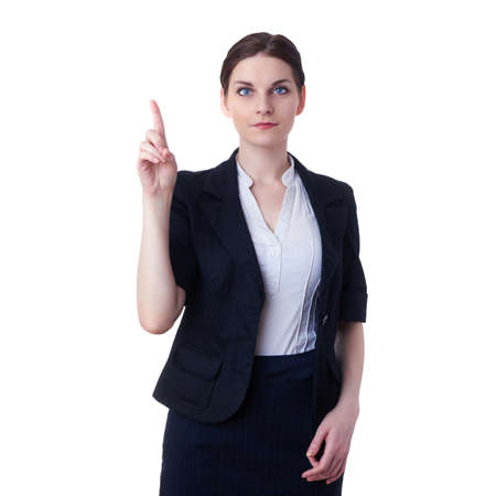 Smiling businesswoman standing over white isolated background pointiong or pushing virtual button, business, education, office conceptの写真素材