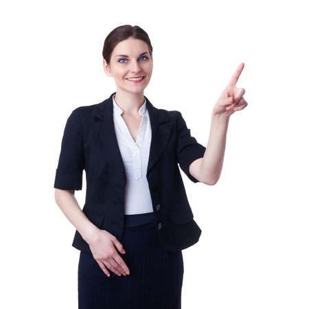 Smiling businesswoman standing over white isolated background pointiong or pushing virtual button, business, education, office conceptの写真素材