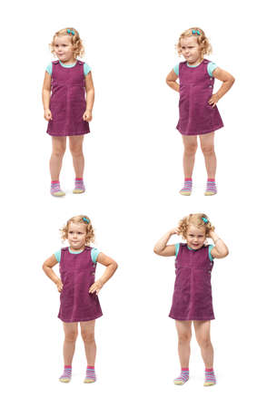 Young little girl with curly hair in purple dress standing over isolated white backgroundの写真素材