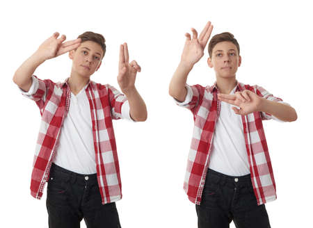 Set of cute teenager boy in red checkered shirt working with virtual screen over white isolated background, half bodyの写真素材