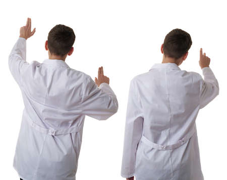 Set of cute teenager boy wearing white lab medic coat working on virtual screen over white isolated background as science, medicine, healthcare concept, back rear viewの写真素材