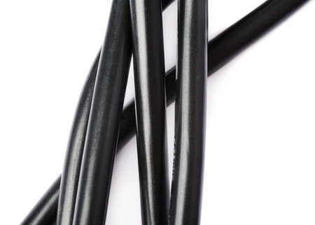 Black electric computer power supply cable isolated over white backgroundの写真素材