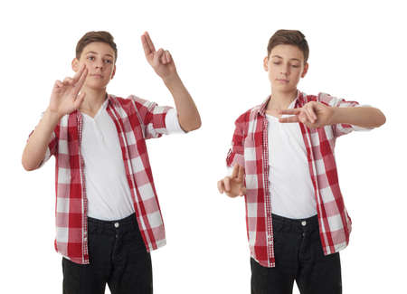 Set of cute teenager boy in red checkered shirt working with virtual screen over white isolated background, half bodyの写真素材
