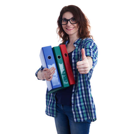 Smiling young woman in casual clothes and glasses over white isolated background with a heap of folders, happy people and lot of work conceptの写真素材