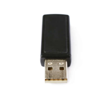 Black flash drive or wireless receiver isolated over white backgroundの写真素材