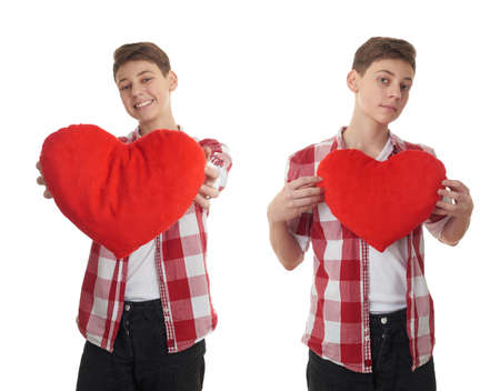 Set of cute teenager boy in red checkered shirt with plush heart over white isolated background, half bodyの写真素材