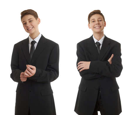 Set of cute teenager boy in back business suit correcting it over white isolated background, half body, future career conceptの写真素材