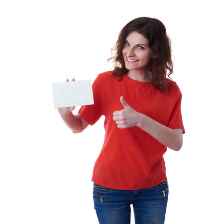 Smiling young woman in casual clothes over white isolated background with blank card in hand, happy people, advertising conceptの写真素材