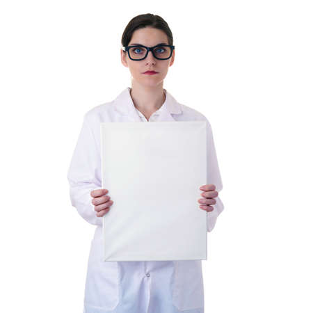 Smiling female doctor assistant scientist in white coat over white isolated background with glasses and white blank board, healthcare, profession, science and medicine conceptの写真素材