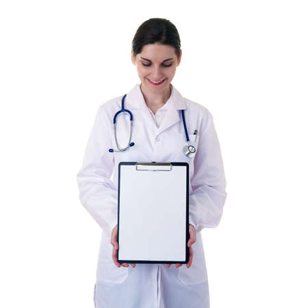 Smiling female doctor in white coat over white isolated background with stethoscope and blank clipboard, healthcare, profession and medicine conceptの写真素材
