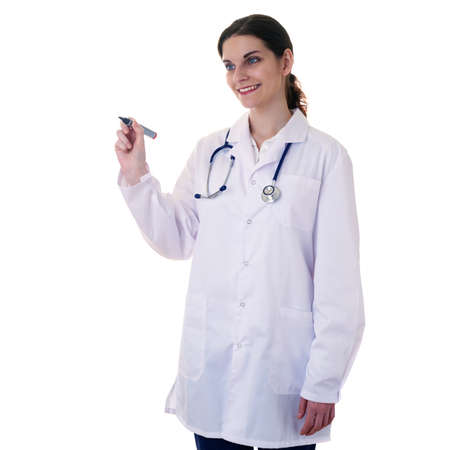 Smiling female doctor in white coat over white isolated background with stethoscope and marker in hand, healthcare, profession and medicine conceptの写真素材