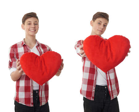 Set of cute teenager boy in red checkered shirt with plush heart over white isolated background, half bodyの写真素材