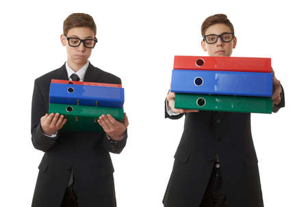 Set of cute teenager boy in back business suit with a pile of folders over white isolated background, half body, future career conceptの写真素材