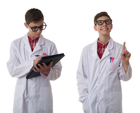 Set of cute teenager boy wearing white lab medic coat and glasses with folder over white isolated background as science, medicine, healthcare conceptの写真素材