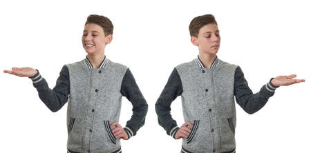 Set of cute teenager boy in gray sweater presenting something on hand over white isolated background, half bodyの写真素材