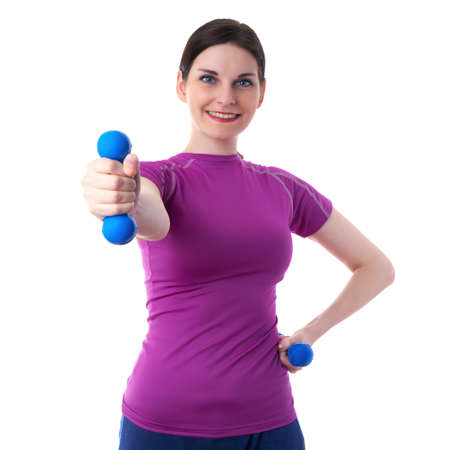 Smiling sporty woman in violet T-short doing exercises with blue dumbbells over white isolated background, fitness, sport and lifestyle conceptの写真素材