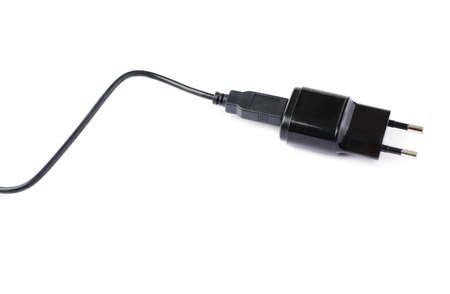Fragment of the black usb adapter charger isolated over the white backgroundの写真素材
