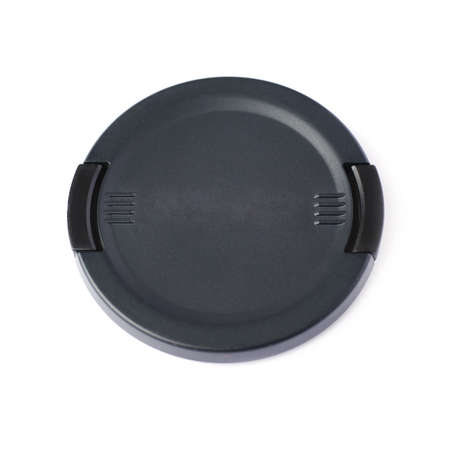 Black camera lens cap isolated over white backgroundの写真素材