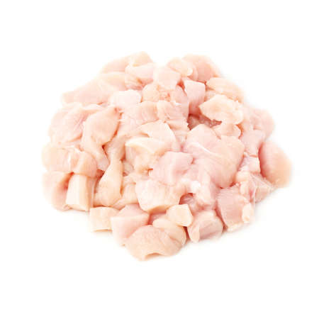 Raw chicken fillet breast cut into pieces isolated over white backgroundの写真素材