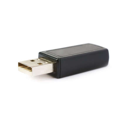 Black flash drive or wireless receiver isolated over white backgroundの写真素材