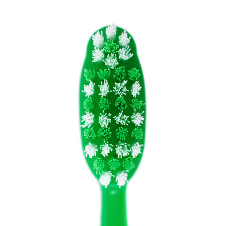 Head of green single toothbrush isolated over white backgroundの写真素材