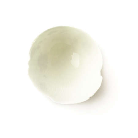 Quail egg shell cracked and broken in halves isolated over white backgroundの写真素材