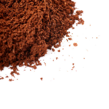 Ground milled black coffee powder isolated over white backgroundの写真素材