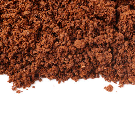 Ground milled black coffee powder isolated over white backgroundの写真素材
