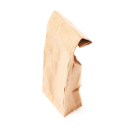 Craft brown closed paper pack for tea or coffee isolated over white backgroundの写真素材